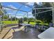 Screened patio with grill and outdoor seating at 5232 Deer Creek Dr, Orlando, FL 32821