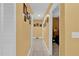 Bright hallway with access to bedrooms and other areas of the home at 5232 Deer Creek Dr, Orlando, FL 32821