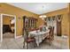 Elegant dining room with ornate furniture and a view into a bedroom at 5232 Deer Creek Dr, Orlando, FL 32821