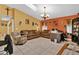 Comfortable living room with two sofas and a home office area at 5232 Deer Creek Dr, Orlando, FL 32821