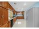 Kitchen with wood cabinets, stainless steel appliances, and light blue walls at 912 Avenue T Se, Winter Haven, FL 33880