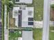 Aerial view of a house with solar panels on the roof at 912 Avenue T Se, Winter Haven, FL 33880