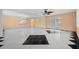 Spacious living area with tile flooring and a modern chandelier at 912 Avenue T Se, Winter Haven, FL 33880