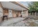 Covered back patio with a concrete floor and a dog house at 912 Avenue T Se, Winter Haven, FL 33880