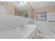 Clean bathroom with white tile and a vanity at 912 Avenue T Se, Winter Haven, FL 33880