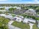 Aerial view showing home's location near a lake and parking area at 912 Avenue T Se, Winter Haven, FL 33880