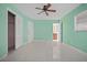 Bedroom with mint green walls, ceiling fan, and tile flooring at 912 Avenue T Se, Winter Haven, FL 33880