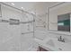 Modern bathroom with a glass shower, marble tile, and vanity at 912 Avenue T Se, Winter Haven, FL 33880