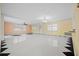 Open living space with tile floors and a chandelier at 912 Avenue T Se, Winter Haven, FL 33880