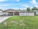Charming ranch home with a large front yard at 912 Avenue T Se, Winter Haven, FL 33880