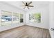 Charming bedroom with large windows and ceiling fan at 751 Avenue B Sw, Winter Haven, FL 33880