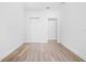 Spacious bedroom with neutral walls and wood-look floors at 751 Avenue B Sw, Winter Haven, FL 33880