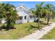 White brick home with a sidewalk at 751 Avenue B Sw, Winter Haven, FL 33880