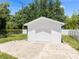 White detached garage with single door and concrete driveway at 751 Avenue B Sw, Winter Haven, FL 33880