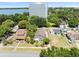 Aerial view of neighborhood, featuring a lake and high-rise building at 751 Avenue B Sw, Winter Haven, FL 33880