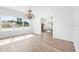 Bright dining room with hardwood floors and a chandelier at 751 Avenue B Sw, Winter Haven, FL 33880
