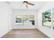 Bright bedroom with large windows and ceiling fan at 751 Avenue B Sw, Winter Haven, FL 33880