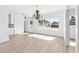 Dining room with hardwood floors, chandelier, and backyard view at 751 Avenue B Sw, Winter Haven, FL 33880