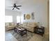 Living room with beige couch and coffee table at 4734 Vero Beach Pl, Kissimmee, FL 34746