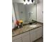 Bathroom with granite countertop and large mirror at 4734 Vero Beach Pl, Kissimmee, FL 34746
