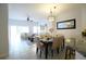 Open concept dining room and living room area at 4734 Vero Beach Pl, Kissimmee, FL 34746