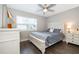 Cozy bedroom with a queen-size bed and ample lighting at 2532 Woodgate Blvd # 105, Orlando, FL 32822