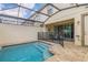 Private pool with safety fence and patio access at 1596 Carey Palm Cir, Kissimmee, FL 34747