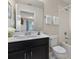 Bathroom with tub, toilet and vanity at 1596 Carey Palm Cir, Kissimmee, FL 34747