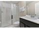 Clean bathroom with shower, toilet and dark vanity at 1596 Carey Palm Cir, Kissimmee, FL 34747