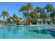 Relaxing pool area with palm trees and ample seating at 1596 Carey Palm Cir, Kissimmee, FL 34747