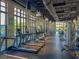 Modern fitness center with a variety of equipment and large windows at 1596 Carey Palm Cir, Kissimmee, FL 34747