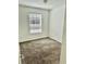 Simple bedroom with window, neutral walls, and carpet at 6265 Contessa Dr # 101, Orlando, FL 32829