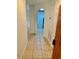 Bright entryway with tile flooring leading to the living room and kitchen at 6265 Contessa Dr # 101, Orlando, FL 32829