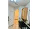 Kitchen with granite countertops, wood cabinets, and view of hallway at 6265 Contessa Dr # 101, Orlando, FL 32829