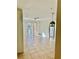 Open living room with tile flooring and access to patio at 6265 Contessa Dr # 101, Orlando, FL 32829