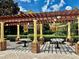 Relaxing community patio with covered seating and picnic tables at 6265 Contessa Dr # 101, Orlando, FL 32829