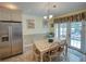Breakfast nook with table and chairs, near kitchen and backyard access at 1049 Lake Berkley Dr, Kissimmee, FL 34746