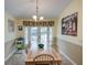 Kitchen breakfast nook with table and chairs, opens to backyard pool at 1049 Lake Berkley Dr, Kissimmee, FL 34746