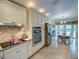 Kitchen boasts stainless steel appliances and ample cabinet space at 1049 Lake Berkley Dr, Kissimmee, FL 34746