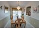 Bright dining room with large table and chandelier at 1049 Lake Berkley Dr, Kissimmee, FL 34746
