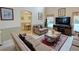 Relaxing living room with ample natural light and view of pool at 1049 Lake Berkley Dr, Kissimmee, FL 34746