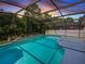 Inviting screened pool area, perfect for relaxation and entertainment at 1049 Lake Berkley Dr, Kissimmee, FL 34746