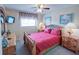 Bedroom with a queen-size bed and wooden dresser at 1049 Lake Berkley Dr, Kissimmee, FL 34746