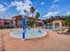 Community splash pad with colorful water features for children at 1049 Lake Berkley Dr, Kissimmee, FL 34746