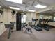 Community fitness center with treadmills, weight machines, and mirrors at 1049 Lake Berkley Dr, Kissimmee, FL 34746