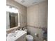 Clean bathroom with single vanity, toilet and shower at 1049 Lake Berkley Dr, Kissimmee, FL 34746