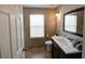Clean bathroom with single vanity and large mirror at 1049 Lake Berkley Dr, Kissimmee, FL 34746