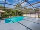 Large screened pool with plenty of space for lounging at 1049 Lake Berkley Dr, Kissimmee, FL 34746