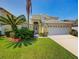 Inviting two-story house with lush landscaping and a driveway at 1049 Lake Berkley Dr, Kissimmee, FL 34746