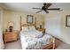 Bright bedroom featuring a queen-size bed and neutral decor at 1049 Lake Berkley Dr, Kissimmee, FL 34746